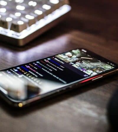 A cell phone on a desk demonstrating live streaming best practices.