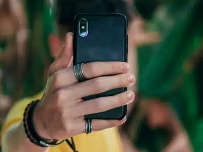 A person captures an image using their smartphone.