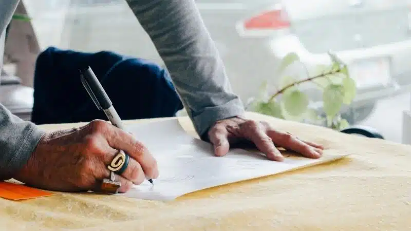 A person signing a record contract.