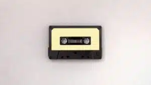 A cassette tape on a white surface demonstrating how to clear a sample.