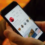 A person showcasing Instagram Reels on their cell phone.