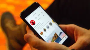 A person using Instagram AR filters on a cell phone.