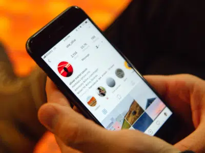 A person using Instagram AR filters on a cell phone.
