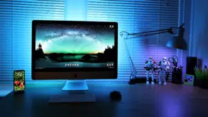 A desk with a monitor on it.