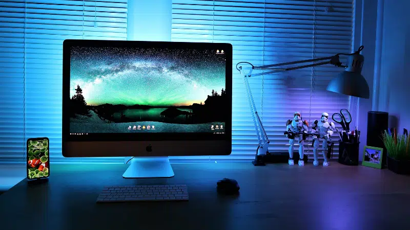 A desk with a monitor on it.