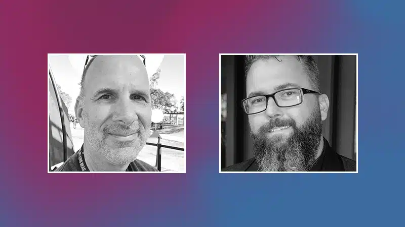 Two men with beards participate in a Q&A session against a vibrant purple backdrop.