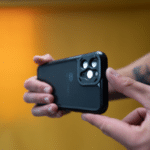 A person showcasing a black iPhone 11 Pro case in a YouTube Shorts video.
