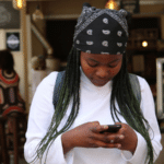 woman texting in a coffee shop