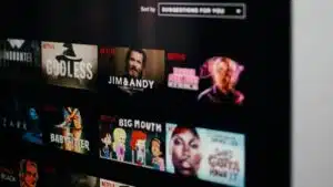 A tv screen showing a synced variety of movies on Netflix.