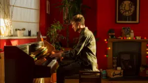 Piano, red walls.