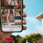 A person proudly displaying an iPhone with an Instagram-inspired photo of a house.