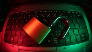 A padlock on a laptop, protecting against potential NFT scammers.