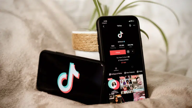 A phone with a TikTok app for analytics.