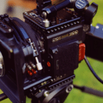 A camera with a cord attached for video distribution.
