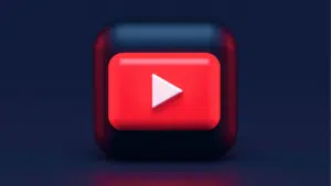 A red button with a red light on it.