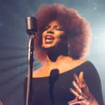 A woman with afro hair performing at the Grammy's.