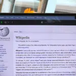 A laptop displaying the Wikipedia website.