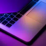 A laptop with purple and blue lights on it designed for social media enthusiasts.