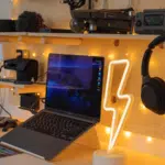 A creative laptop on a desk.