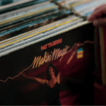 A person is browsing a record store.