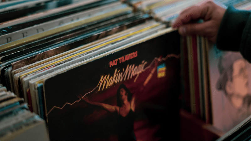 A person is browsing a record store.