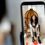 A TikTok-inspired smartphone adorned with a woman's face.