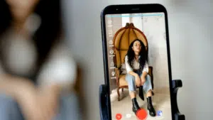 A TikTok-inspired smartphone adorned with a woman's face.