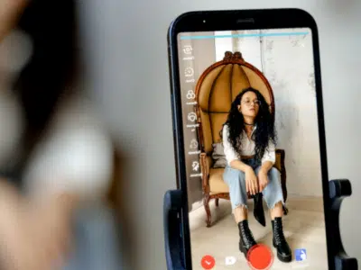 A TikTok-inspired smartphone adorned with a woman's face.