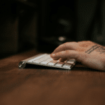 An artist typing on a keyboard.