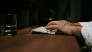 An artist typing on a keyboard.