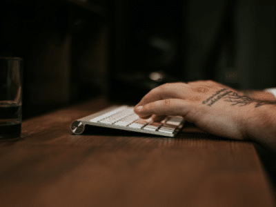 An artist typing on a keyboard.