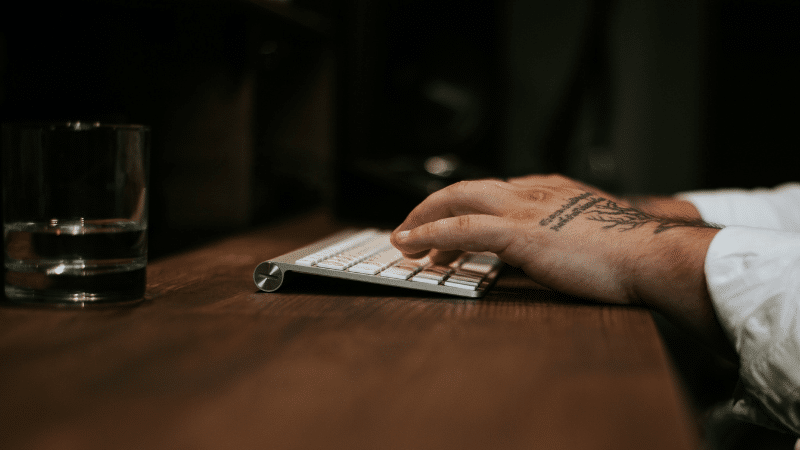 An artist typing on a keyboard.