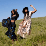 two african american women dancing in a field