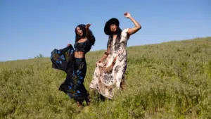 two african american women dancing in a field