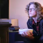 guy with popcorn watching tv