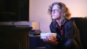 guy with popcorn watching tv