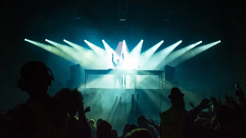 people dancing in crowd at dance event