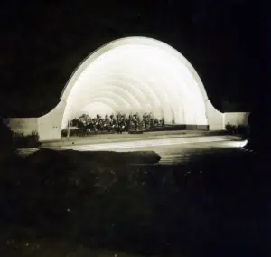 An old photograph of a concert hall at night.