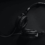 A streaming black and white photo of a pair of headphones.
