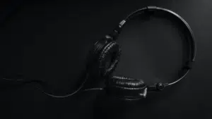 A streaming black and white photo of a pair of headphones.