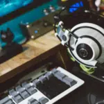 A desk with a keyboard, mouse, and a gaming headset.