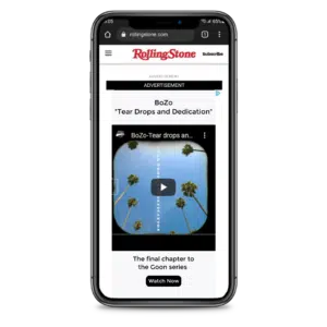 A smartphone screen displaying the rolling stone website with an advertisement for a music track titled "boz*o tears and dedication," along with a play button, part of a series called "the final chapter.