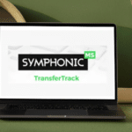 A laptop on a desk displaying a presentation slide with the words "TransferTrack" in front of a minimalist backdrop.