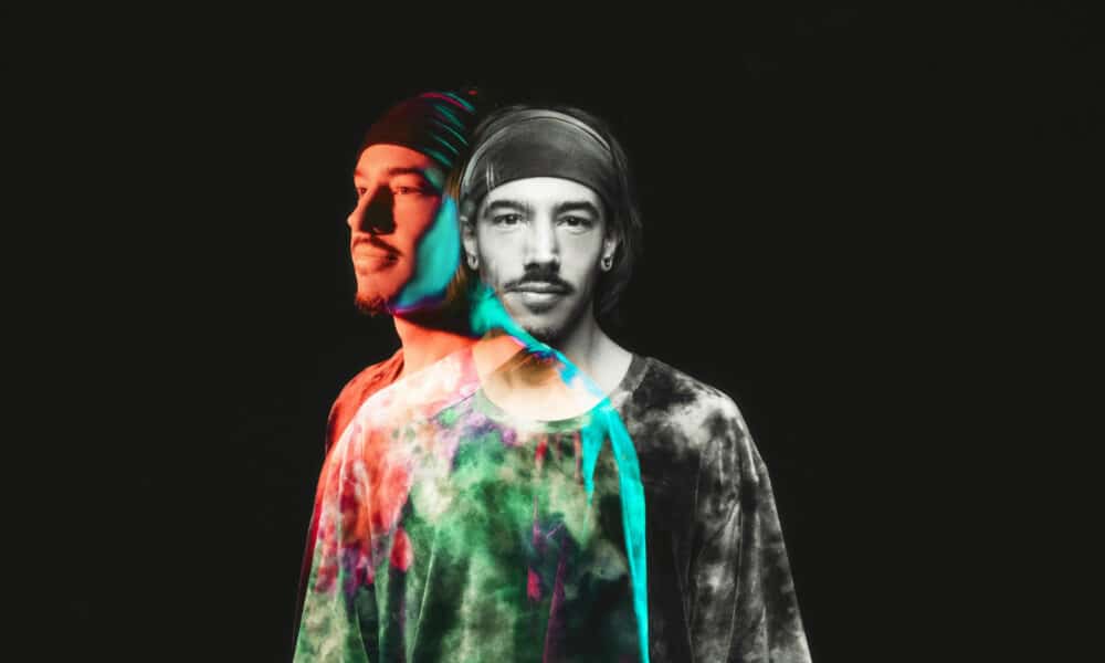 Double exposure image of a man wearing a headband and tie-dye shirt, creating a colorful and slightly transparent effect against a black background, reminiscent of vibrant album art for new music.