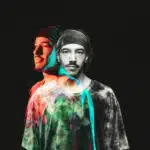 Double exposure image of a man wearing a headband and tie-dye shirt, creating a colorful and slightly transparent effect against a black background, reminiscent of vibrant album art for new music.