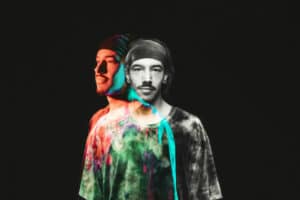 Double exposure image of a man wearing a headband and tie-dye shirt, creating a colorful and slightly transparent effect against a black background, reminiscent of vibrant album art for new music.