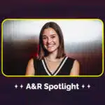 A woman smiling in front of a metallic background with the text "A&R Spotlight" below, highlighting emerging talents in music.