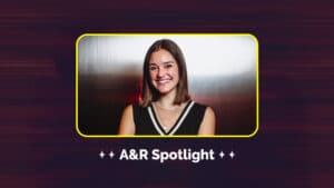 A woman smiling in front of a metallic background with the text "A&R Spotlight" below, highlighting emerging talents in music.