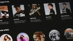 A digital music playlist interface displays various curated playlists with titles such as "Are & Be," "RapCaviar," "Get Turnt," and "Beats & Rhymes." Circular album art is featured below each playlist title.