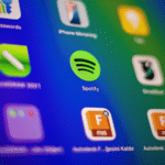 A close-up view of a digital screen displays various app icons, including Spotify and its Spotify Wrapped feature, on a colorful gradient background.